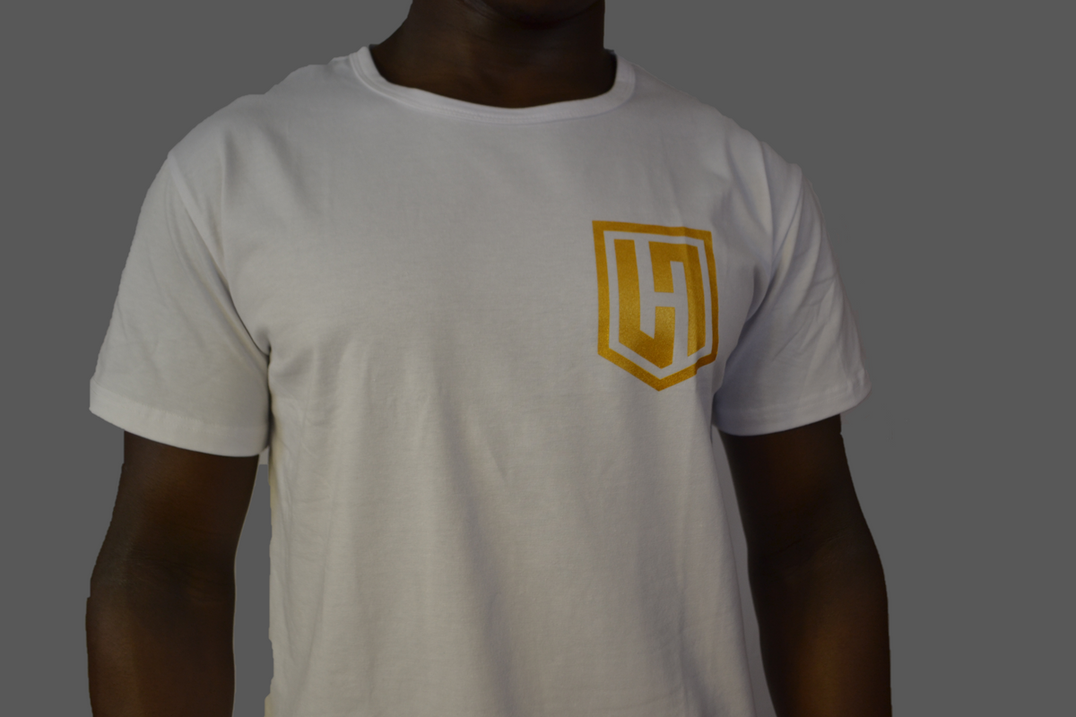 Hustle Passion Knowledge T-shirt in white, front view with gold H shield logo on the chest